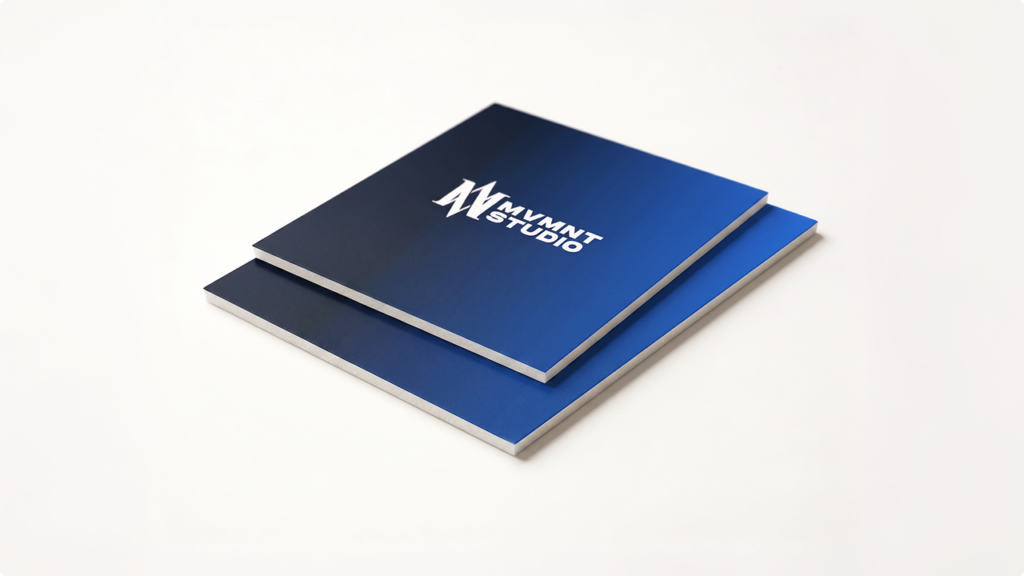 Two blue gradient business cards stacked on a pale background; top card displays the white 'MYMNT STUDIO' logo.